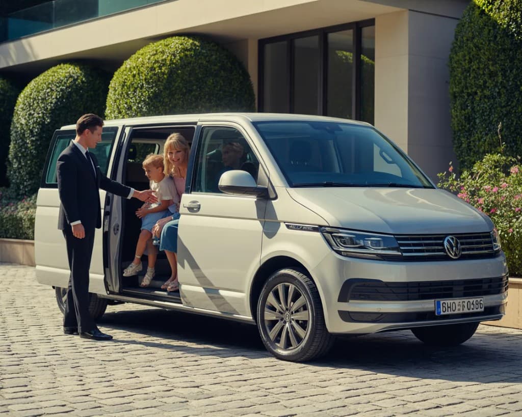 White Volkswagen Transporter T6 9-seat minivan for private transfers from Sparta